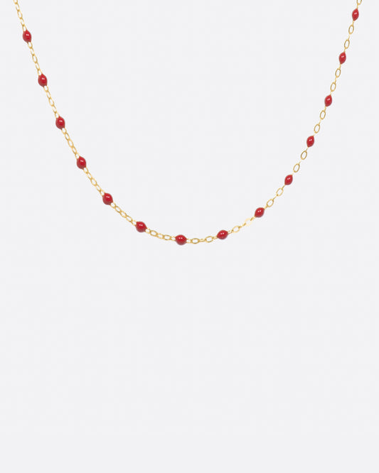 Thin 18k yellow gold chain necklace with resin beads, shown in a 16 inch length