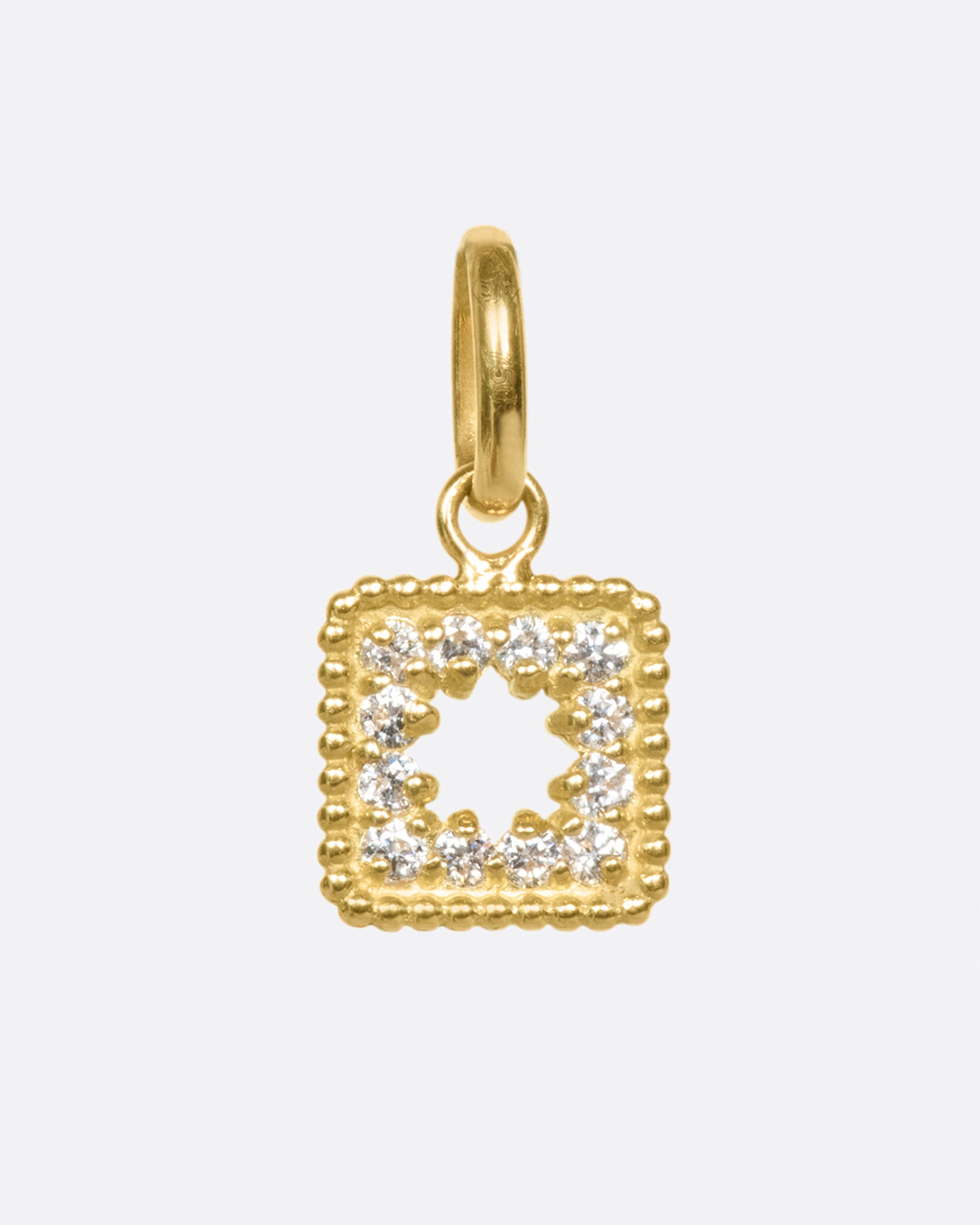 A little window pendant lined with twelve diamonds.