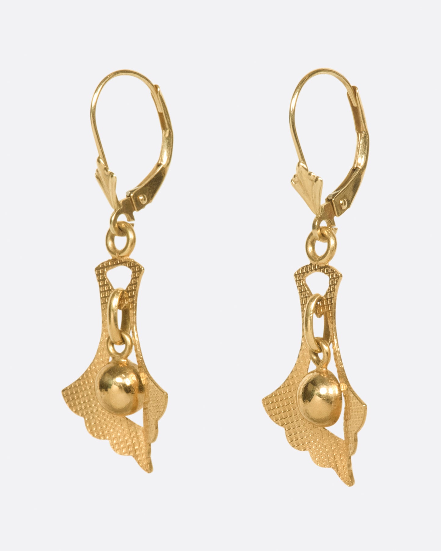 A pair of leverback earrings whose drops have great motion and sparkle just enough in the sun.