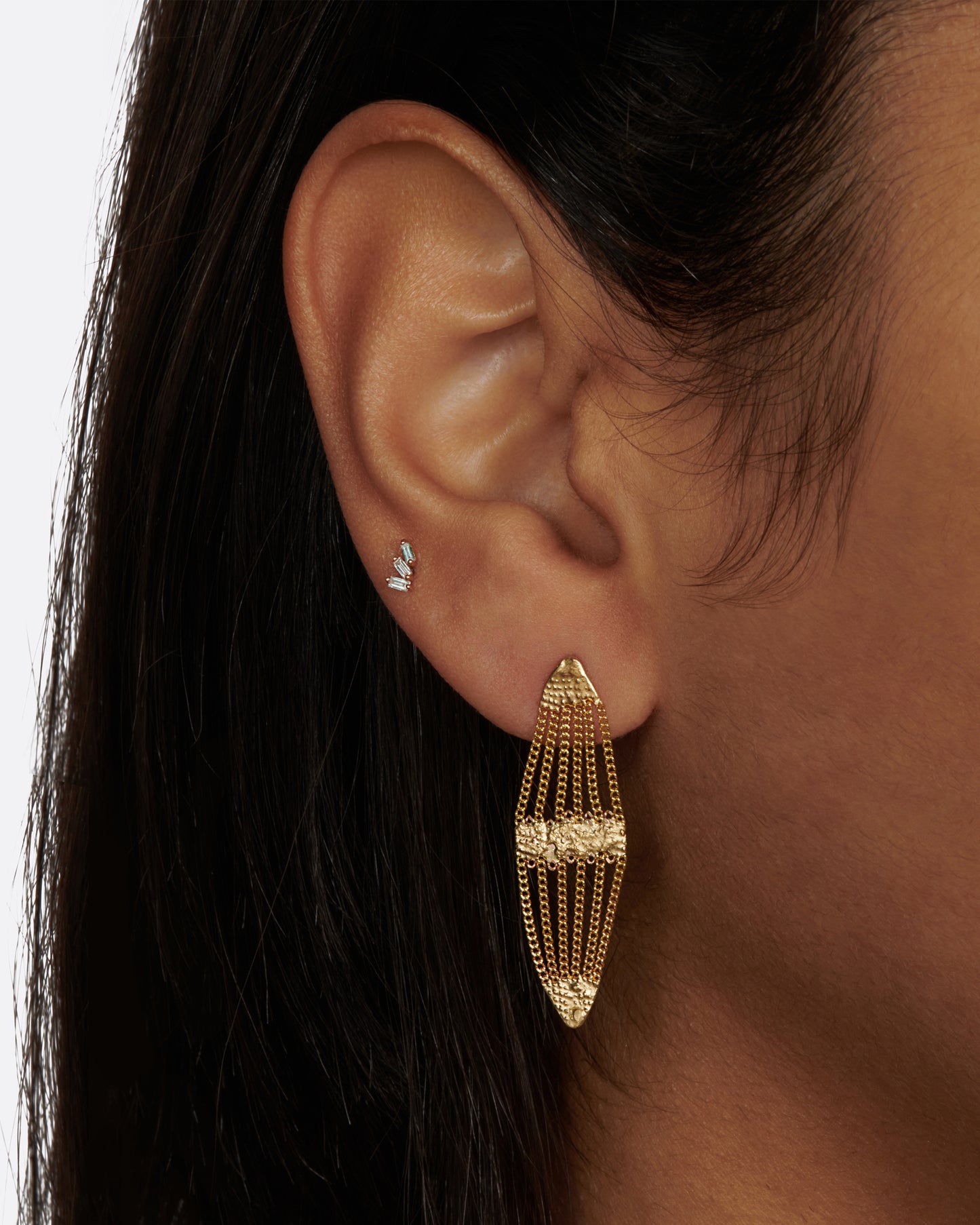 A pair of canoe-shaped earrings made of gold chain and solder.