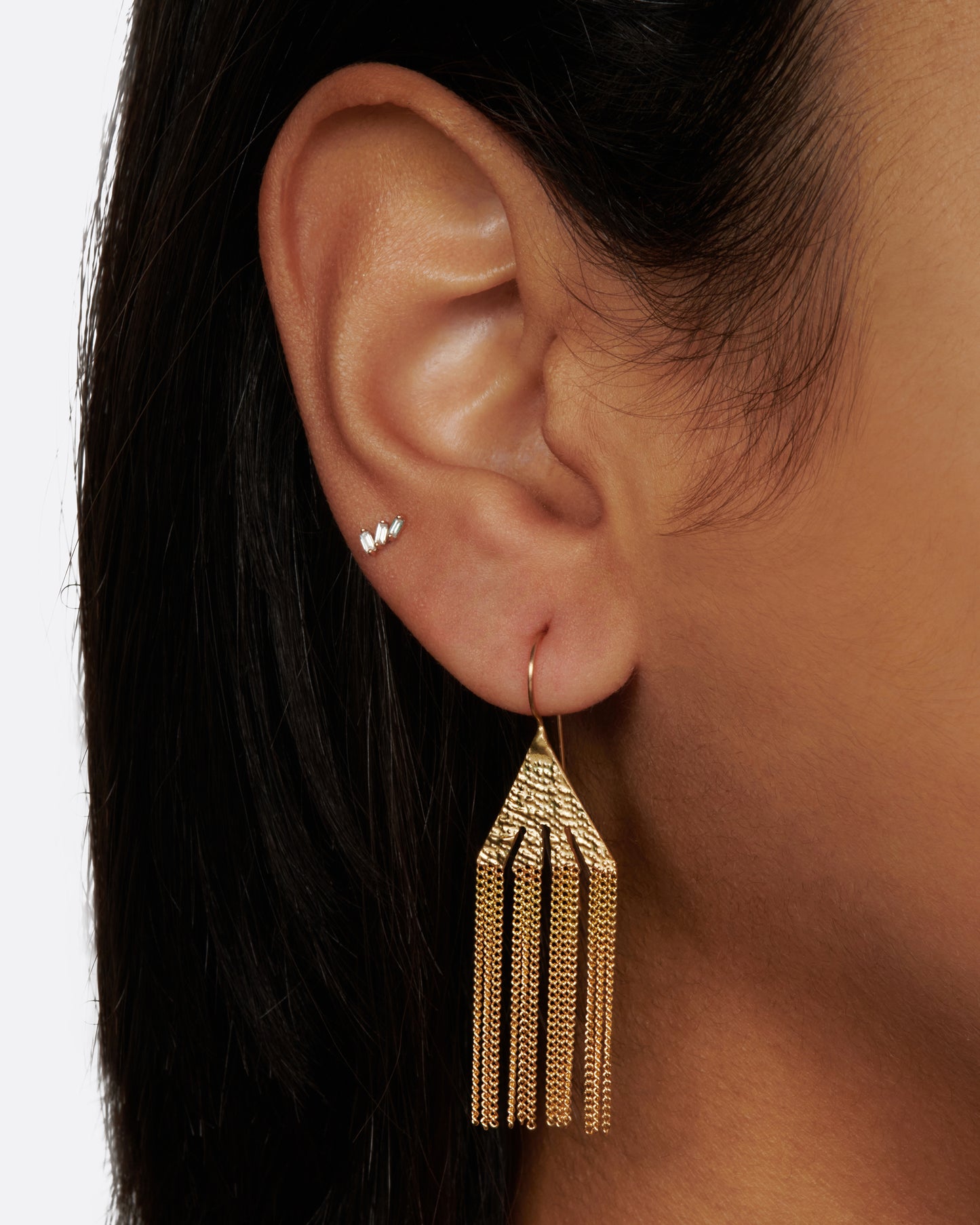 A pair of earrings made of chains with free flowing drops that hang like icicles.