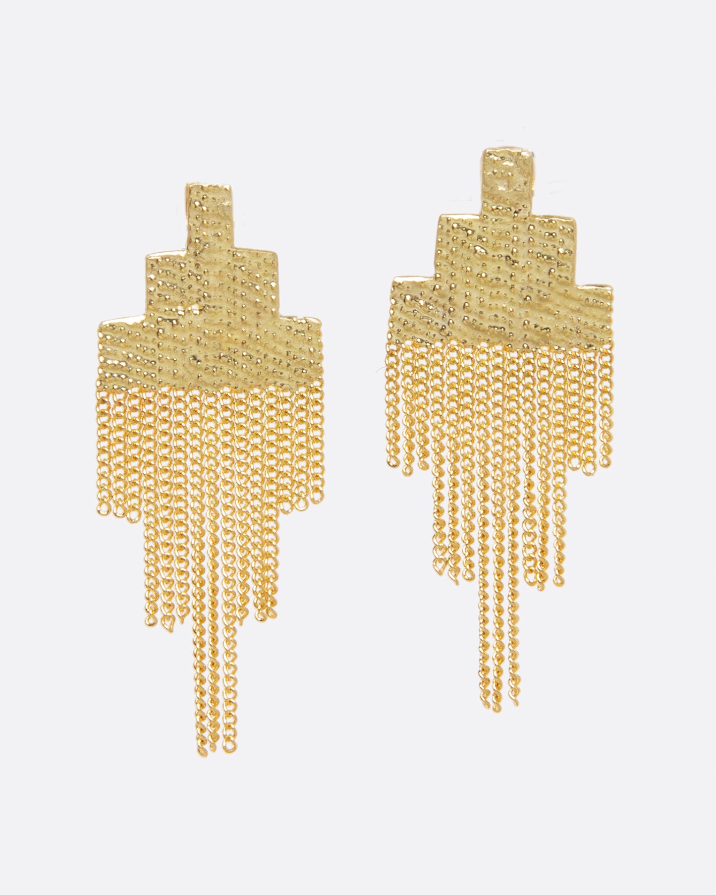 A pair of earrings made of chains in the shape of pixels. The top half has been soldered together to make it solid, but the bottom half is left to move with the wearer. 