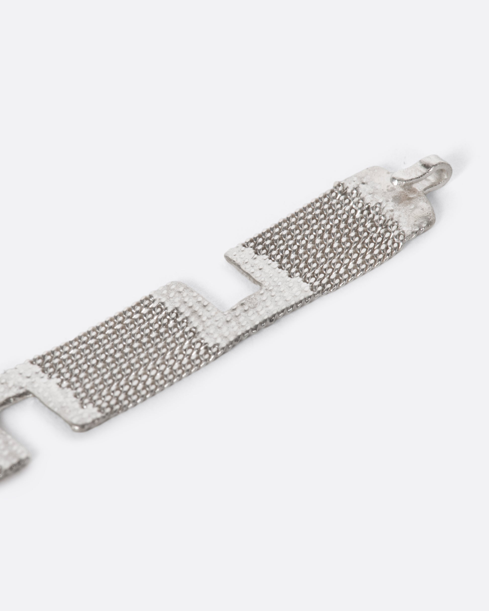 A sterling silver multi-strand chain bracelet with alternating pattern finished with silver solder.