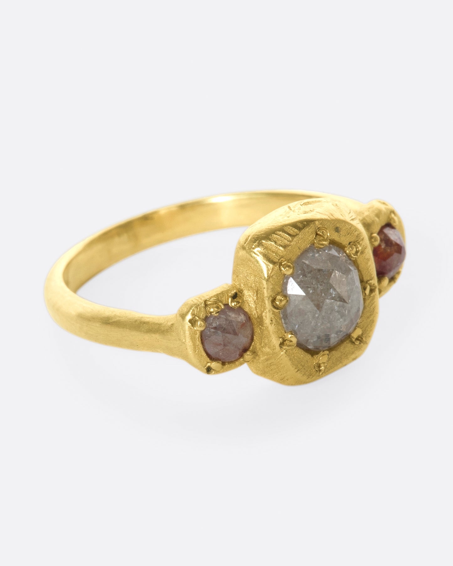 A one of a kind, organic take on a traditional trio ring.