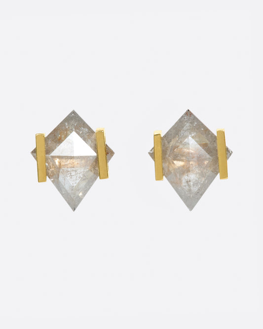 These spectacular studs may be diamond solitaires by definition, but they're far from traditional.