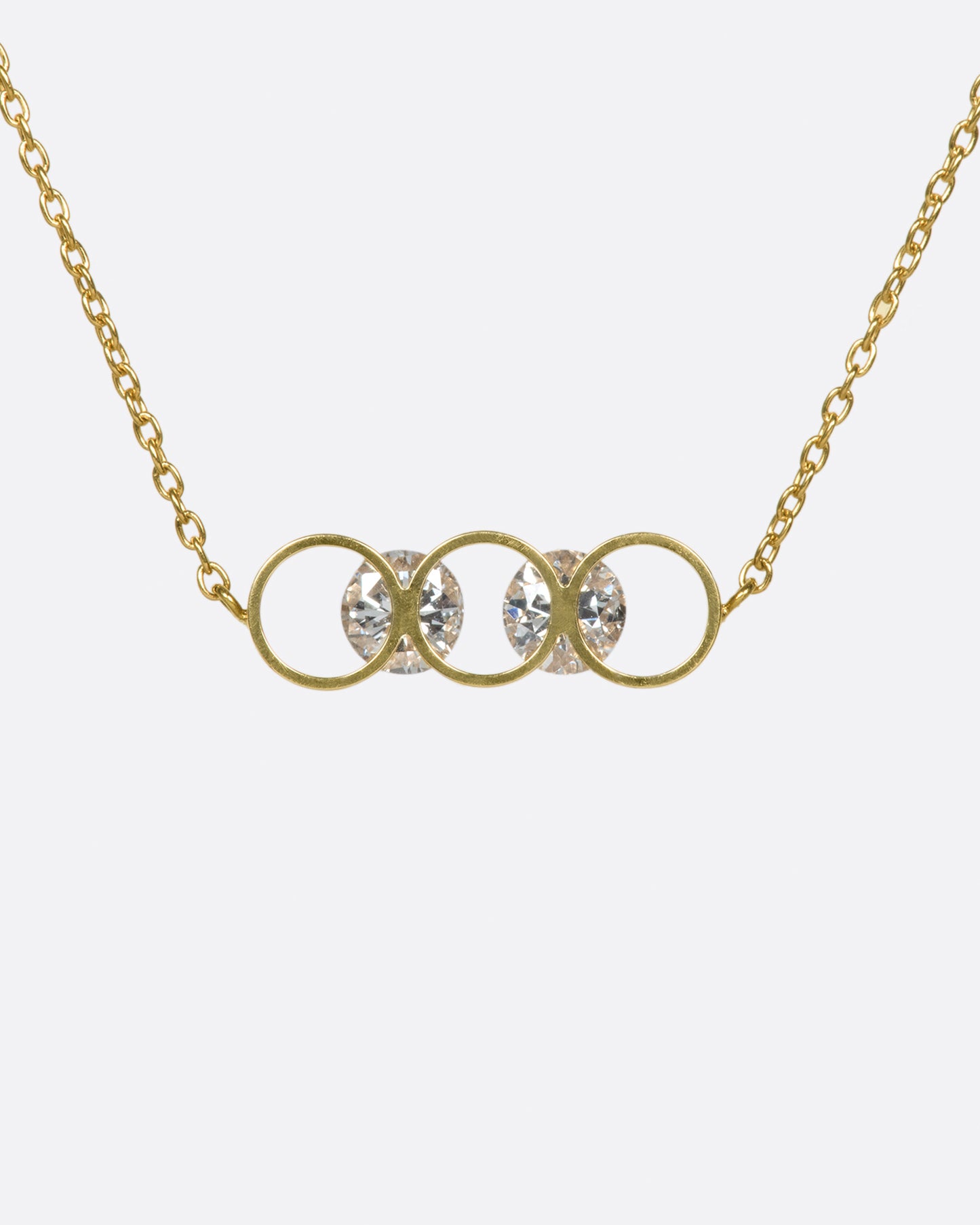 A gold bar of concentric circles and round diamonds