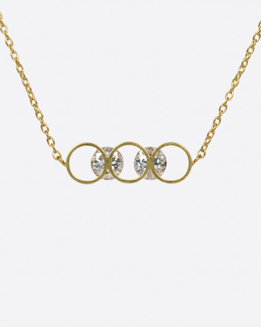 A gold bar of concentric circles and round diamonds