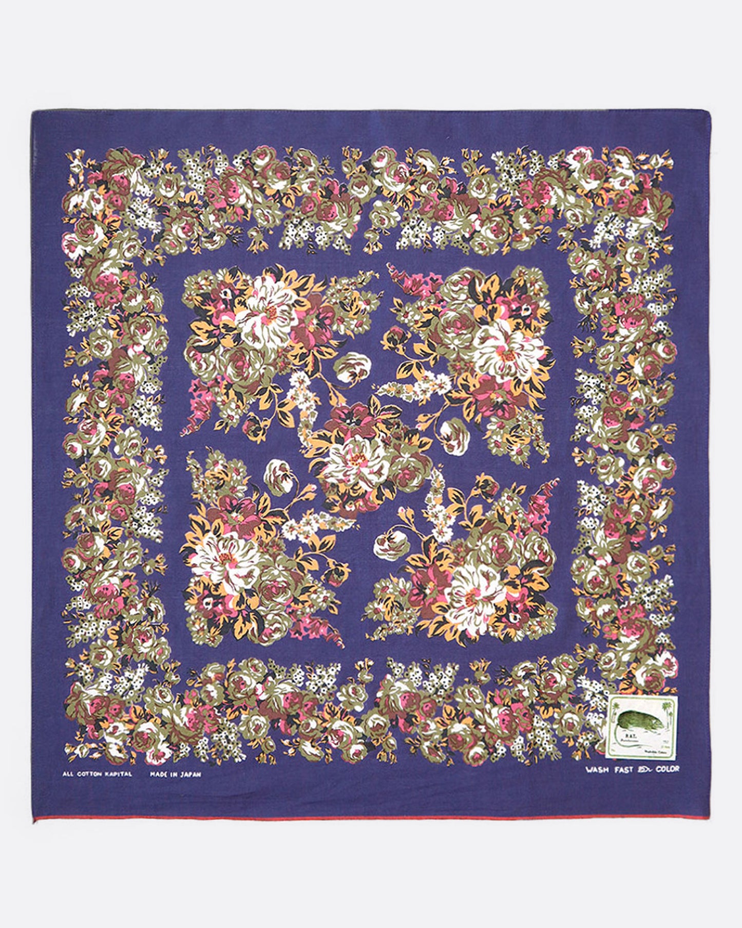 A purple cotton bandana with a flower trim.
