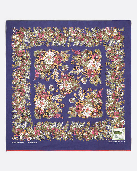 A purple cotton bandana with a flower trim.