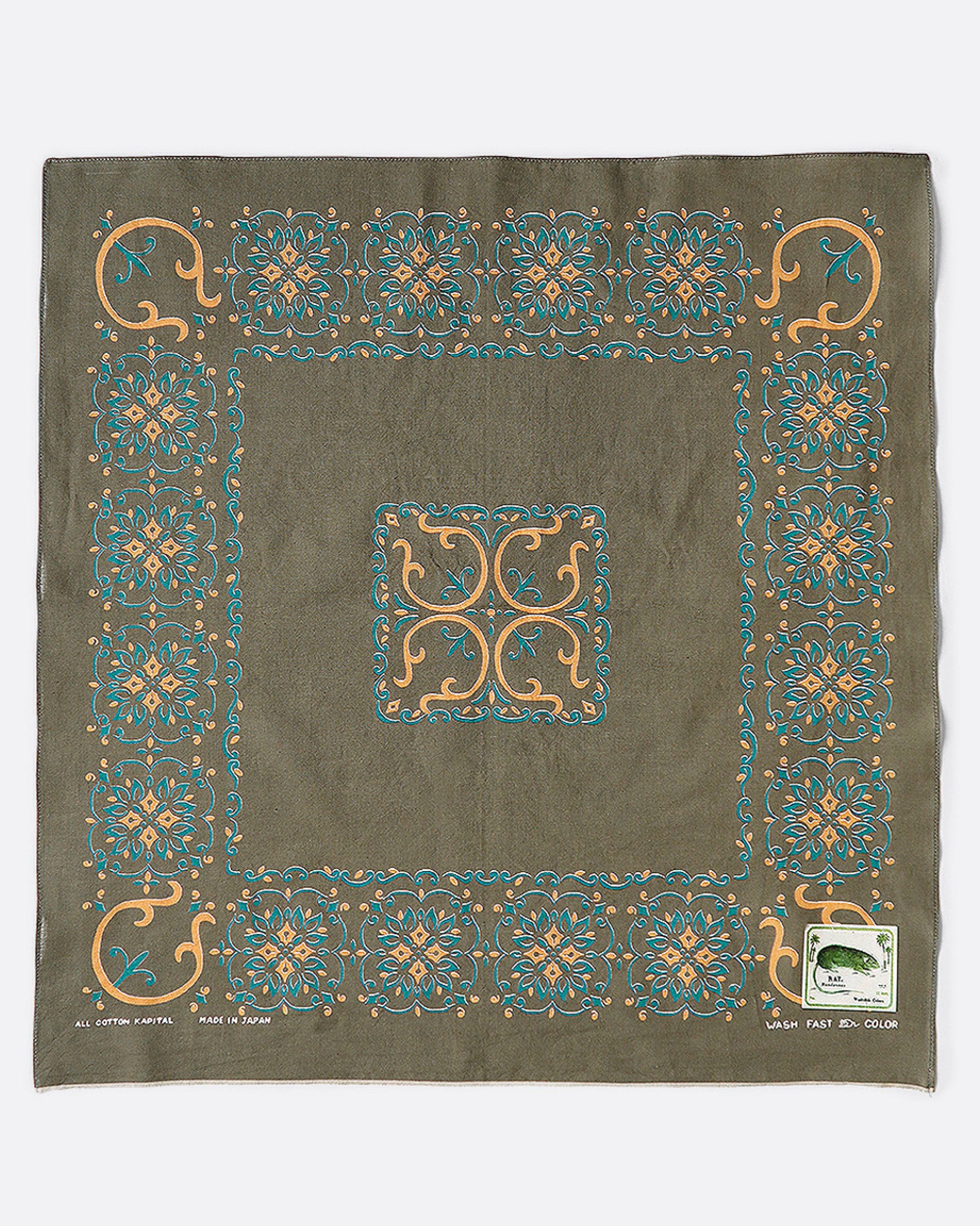A khaki green bandana with a naja motif as a border. 