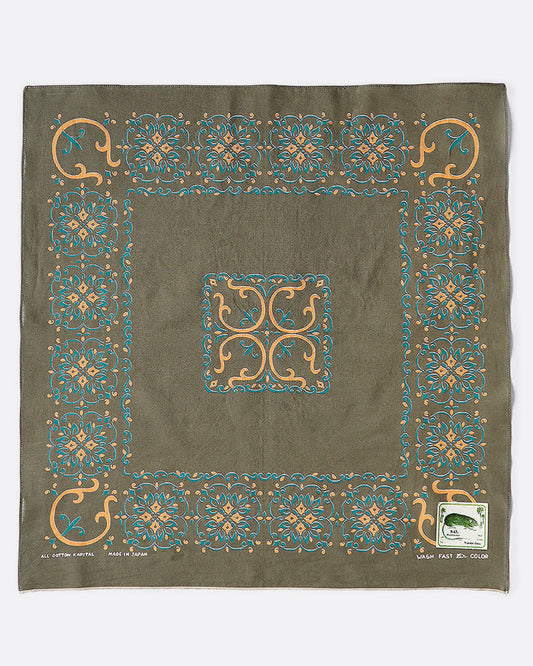 A khaki green bandana with a naja motif as a border. 