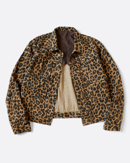 A leopard print leopard jacket in heathered wool with a silky lining. It has a snap button front and a cinch-able back. Shown from the front. 