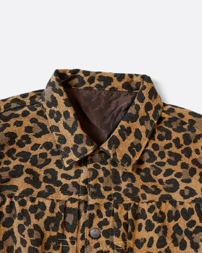 A leopard print leopard jacket in heathered wool with a silky lining. It has a snap button front and a cinch-able back. Shown from the front. 