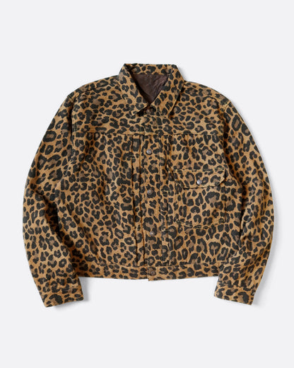 A leopard print leopard jacket in heathered wool with a silky lining. It has a snap button front and a cinch-able back. Shown from the front. 