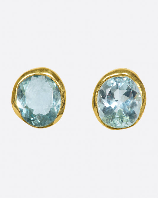 A pair of yellow gold and aquamarine solitaire stud earrings.