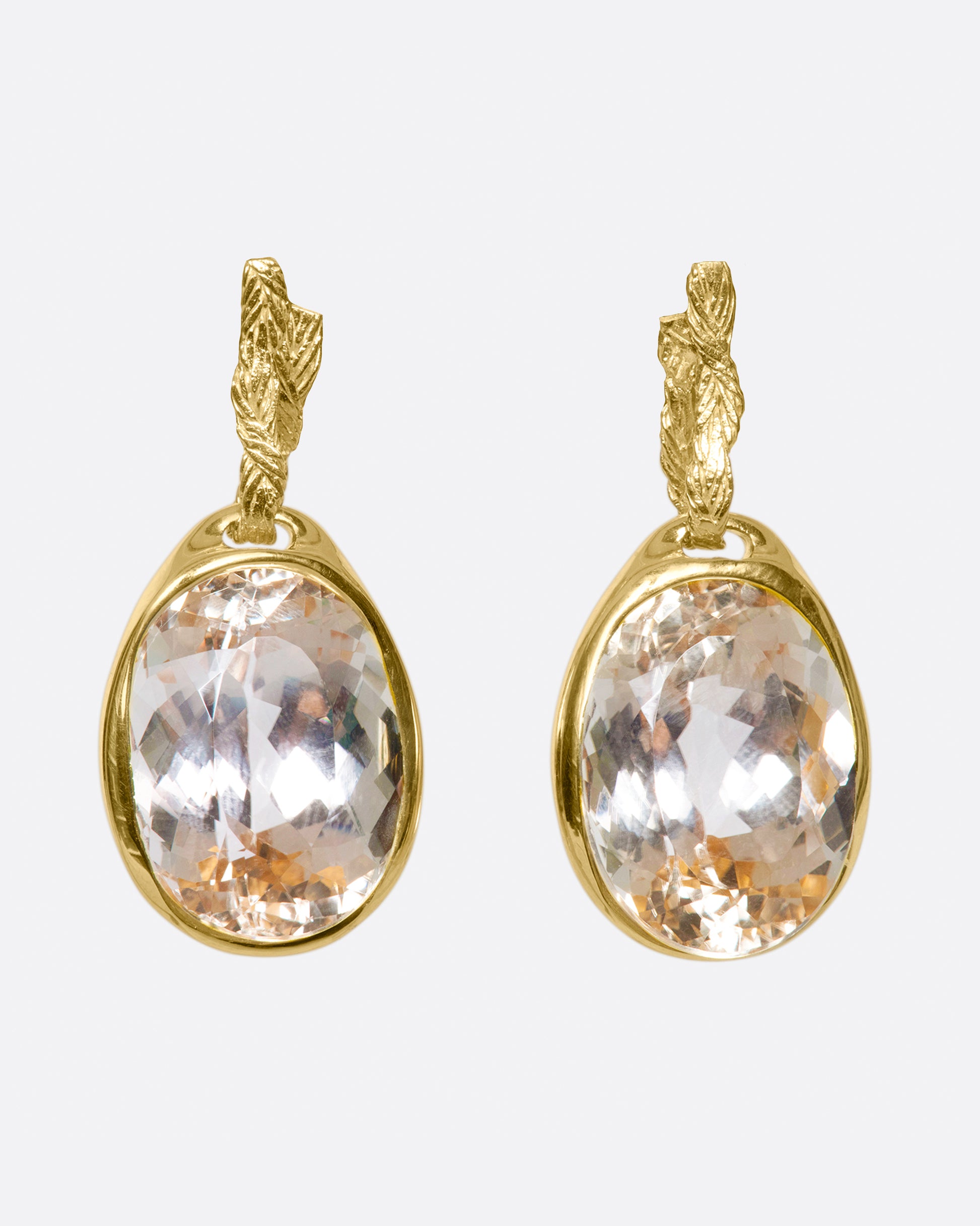 These earrings are all about the mesmerizing, large, pale pink kunzites that they feature.