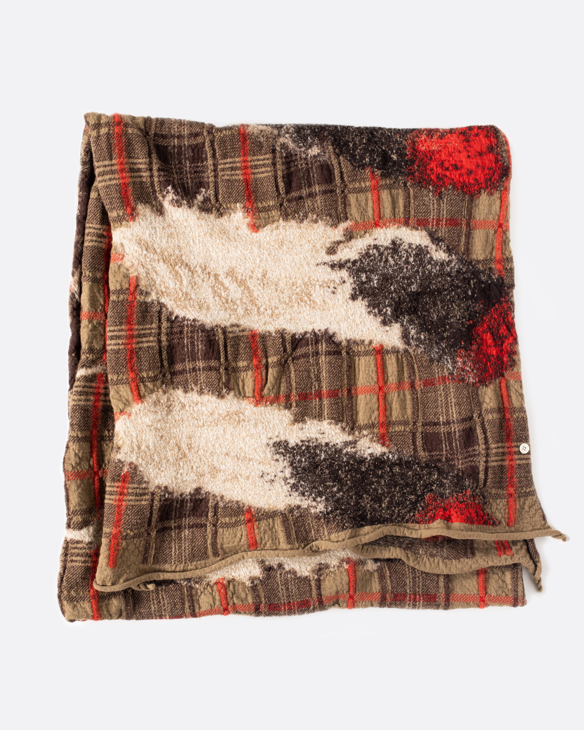 This scarf combines traditional Scottish tartan with long, majestic feathers.
