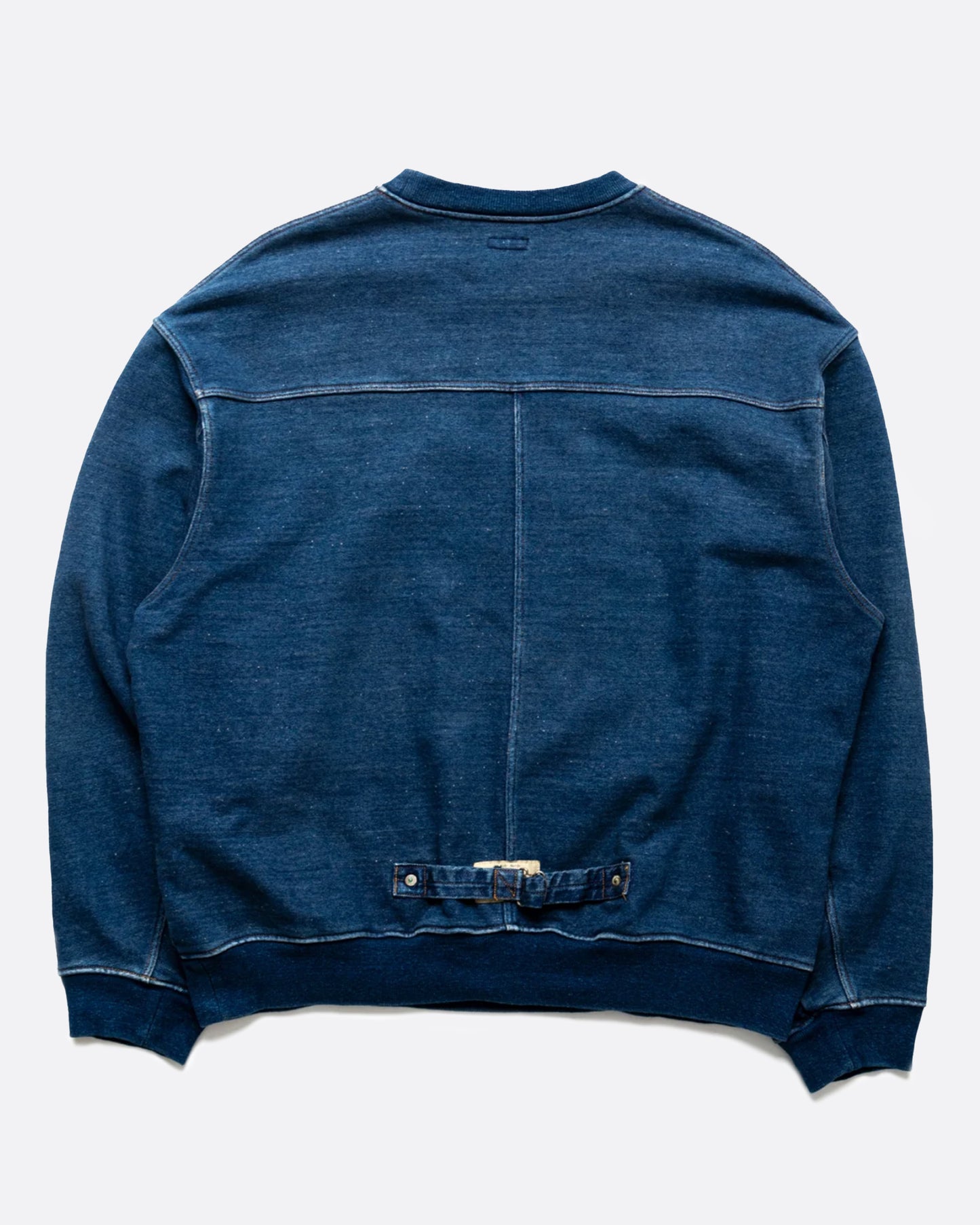 A loose fitting, indigo fleece sweatshirt with a T-shaped split back and cinch.