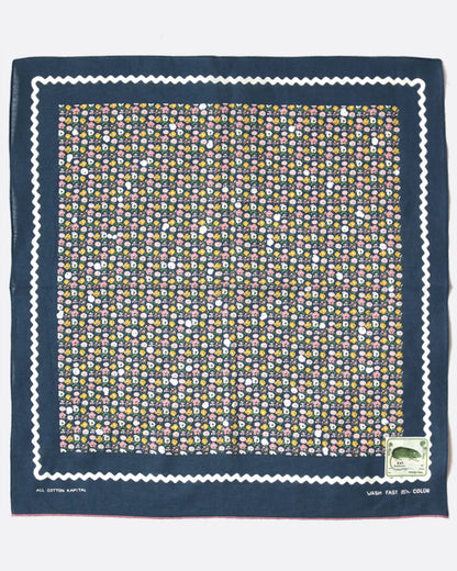 Kapital fastcolor selvedge bandana in navy, with a small multicolor skull and flower print and a white wavy border