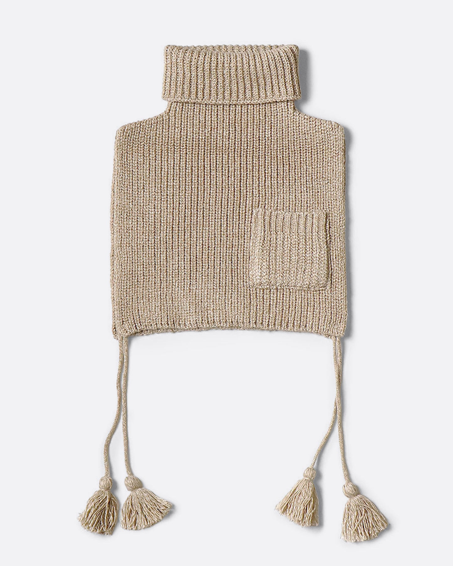 A beige loose knit bib poncho with a front pocket, long tassels, and a high neck, shown from the front. 