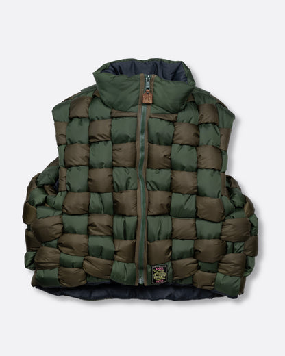 A green nylon padded vest woven in a traditional basket weave design. It has a reversible grey interior, a front zip closure, curved hemline, and internal snap welt hand pockets. Shown from the front.