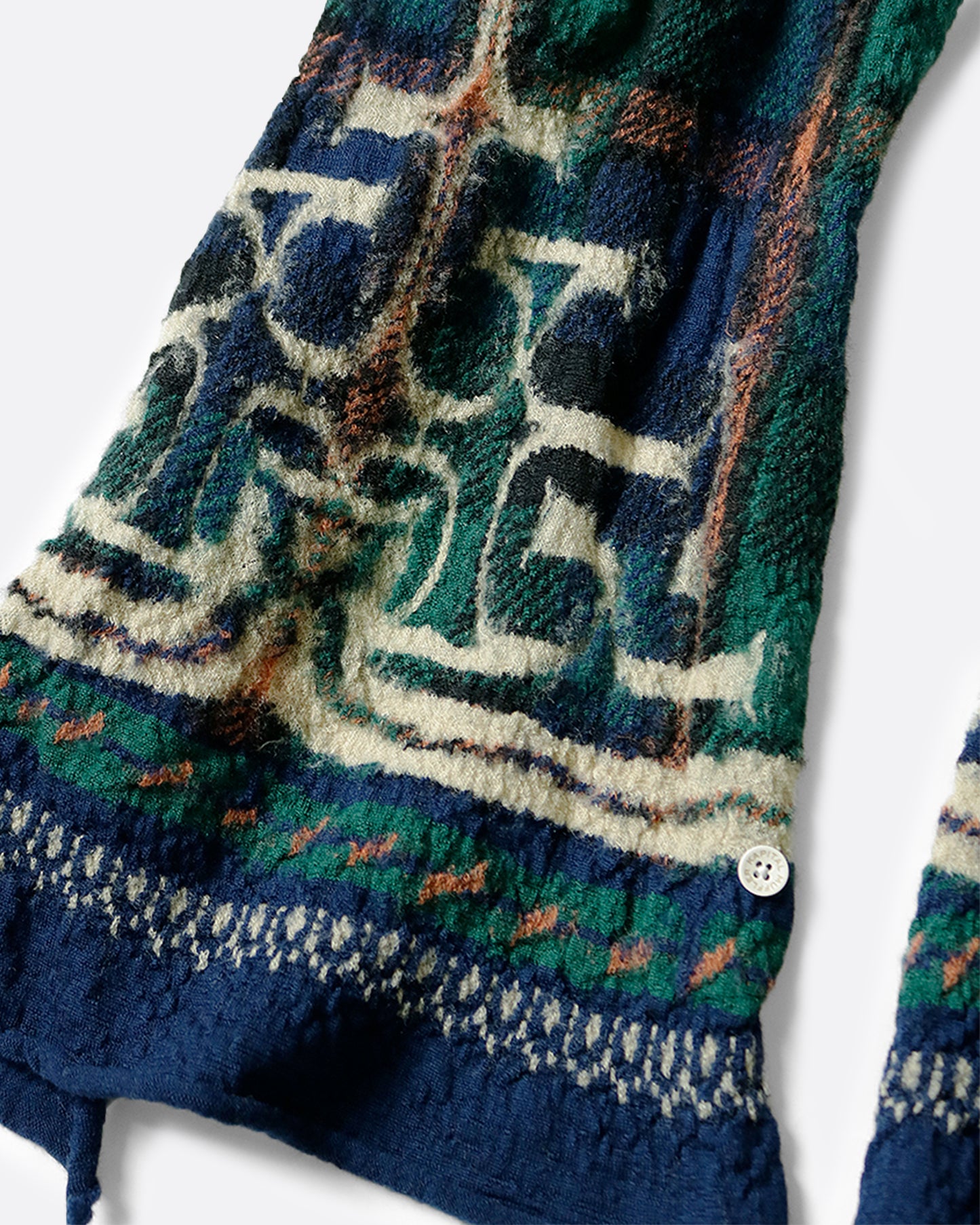 This scarf combines traditional Scottish tartan and Japanese Ainu patterns.