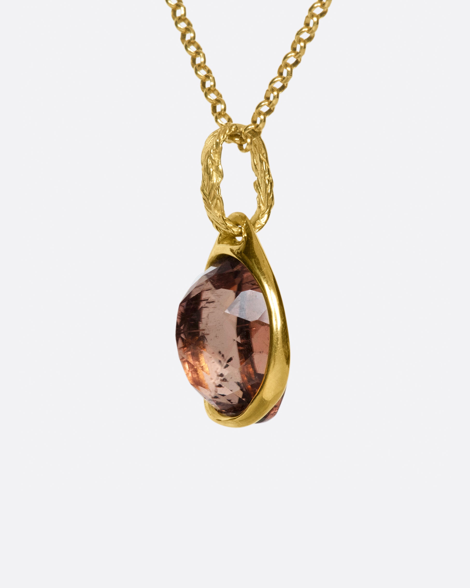 A faceted, pink tourmaline pendant that can be worn facing either way to celebrate the glory of the stone.