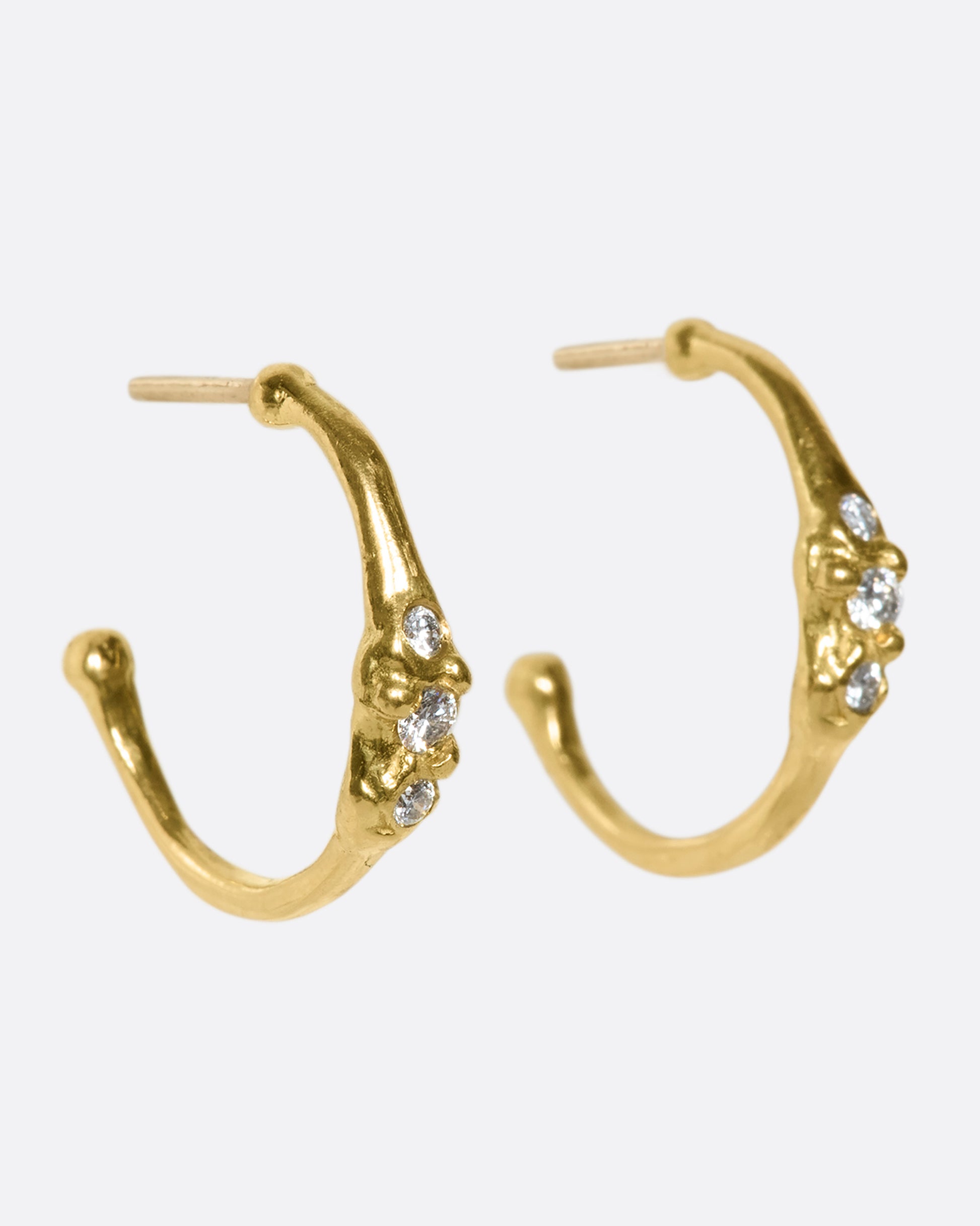 18k gold stud hoops with three diamonds set across the front