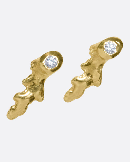 This pair of 18k gold studs dotted with round diamonds looks like tiny pieces of coral adorning your ear.