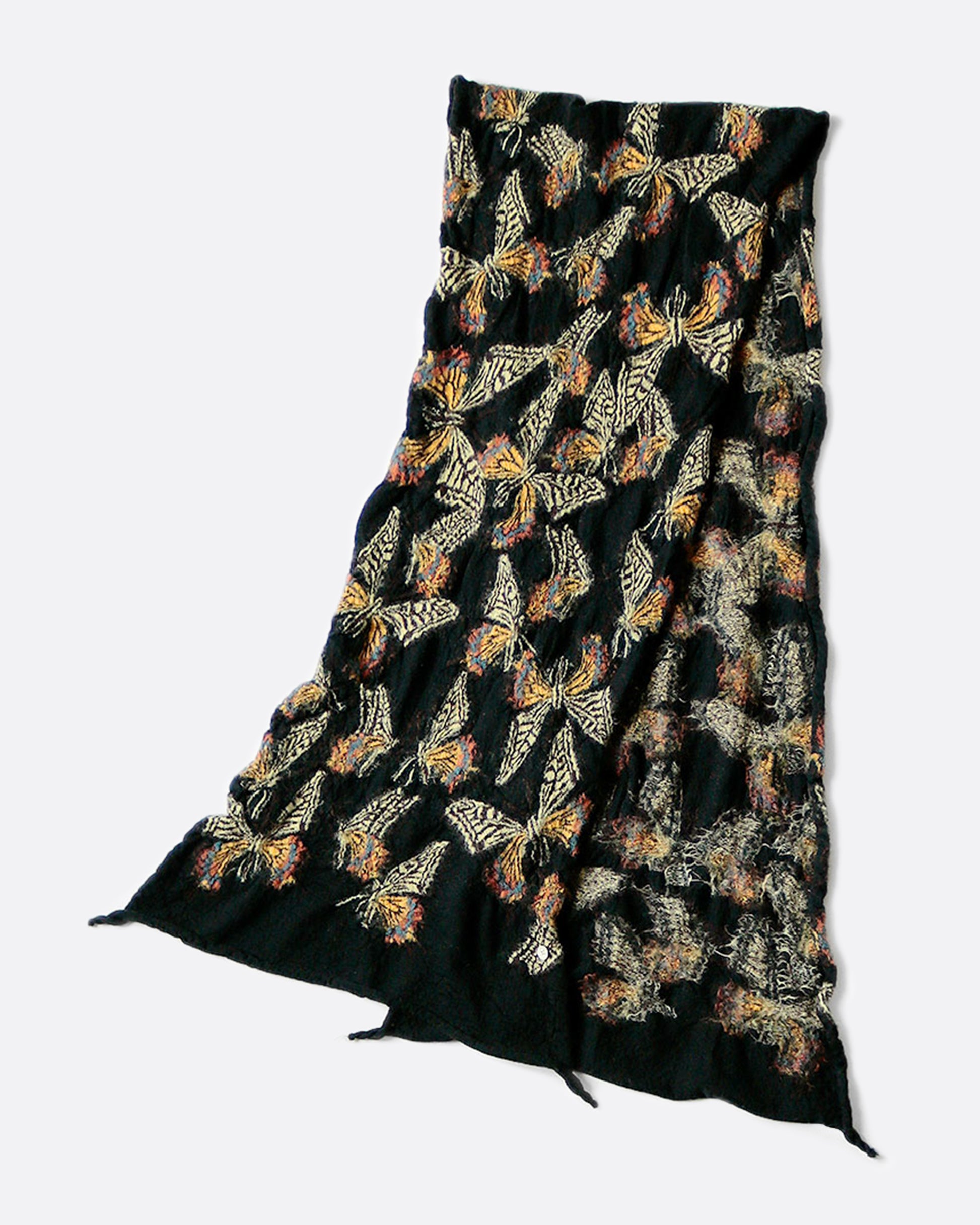 A black wool scarf covered in neutral tone, fluttery butterflies.