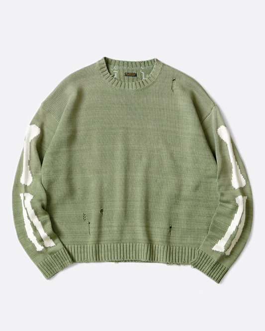 A distressed, sage green crewneck sweater with Kapital's beloved bone design on the back and sleeves. 