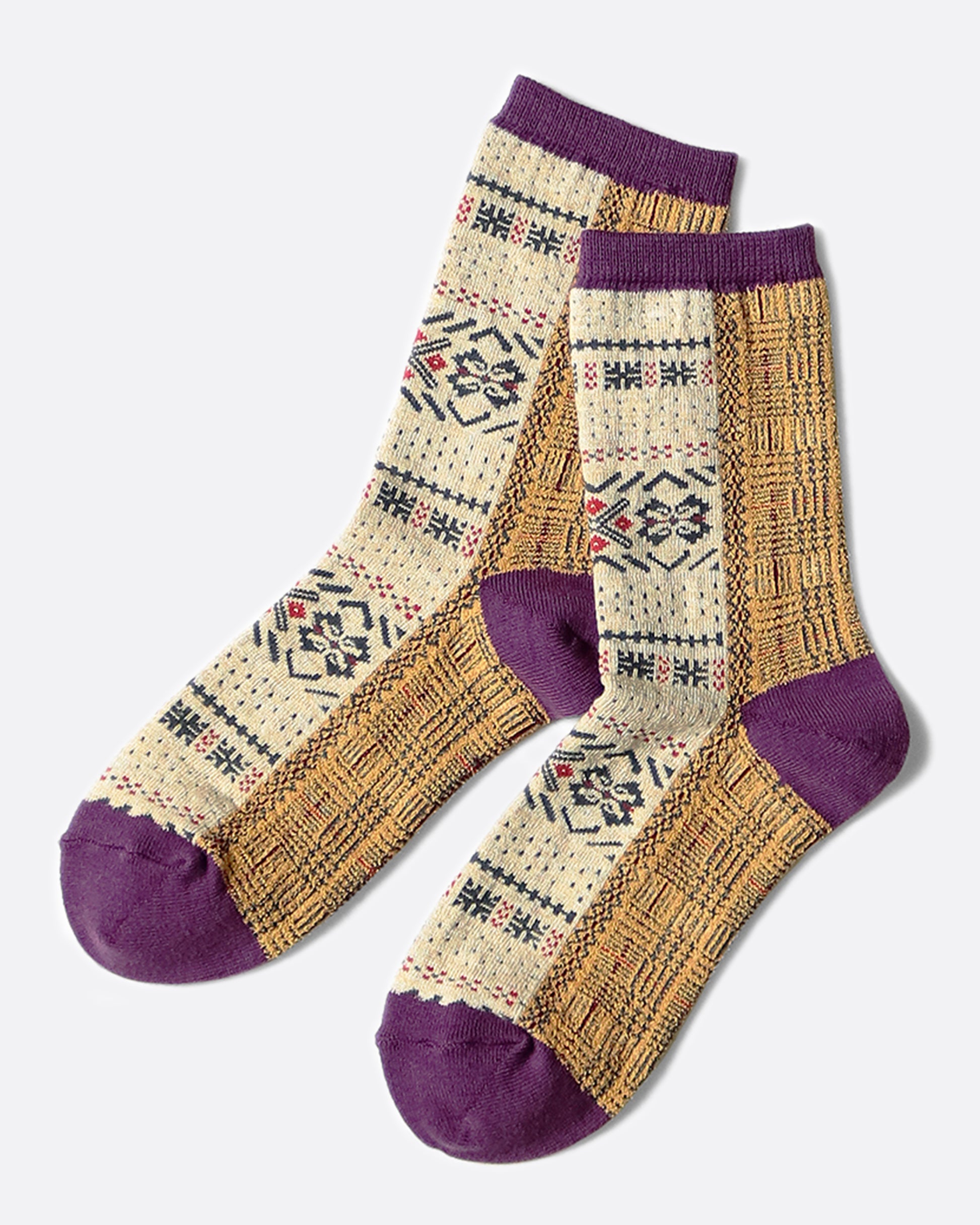 Woven with a beautiful fair isle pattern, these socks hit mid-calf and are comfortable in shoes or around the house.