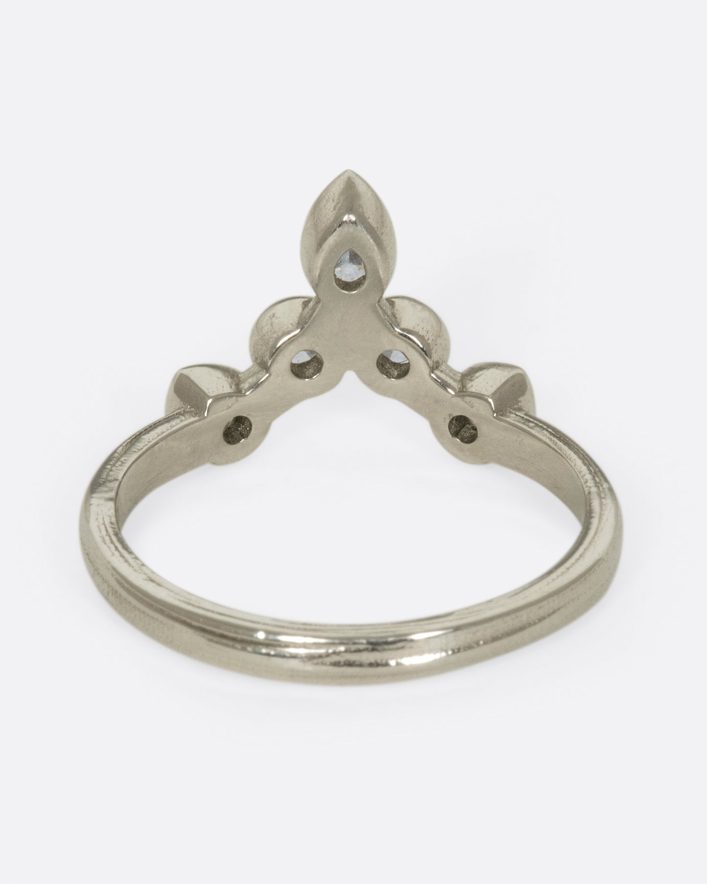 This crowning design can be worn in either direction on the finger, alone, or stacked with another one of Karen's creations - We love it with one of her Invincible Heart rings