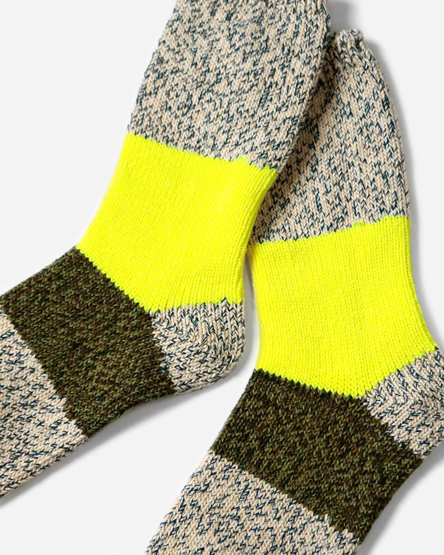 These thick heather gray socks are rich and fluffy with wide neon yellow and olive green stripes down the center.