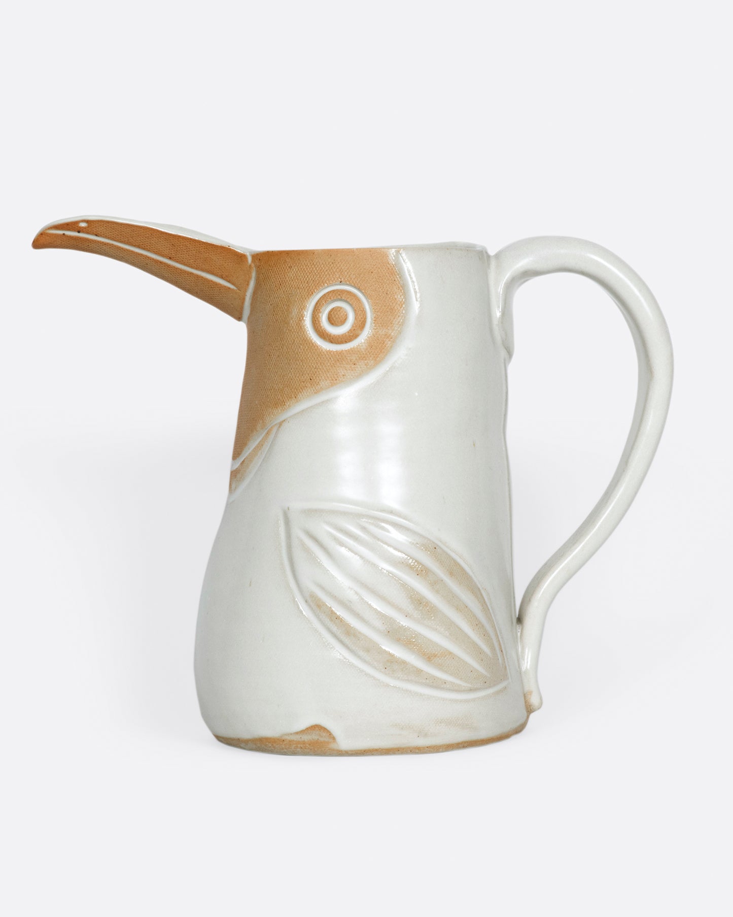 A ceramic pitcher to hold your favorite beverage or flowers.