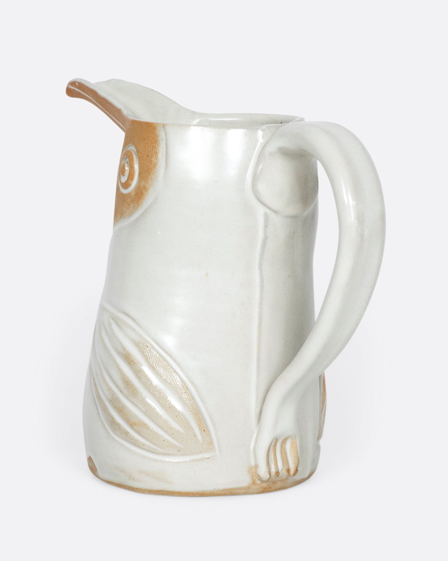 A ceramic pitcher to hold your favorite beverage or flowers.