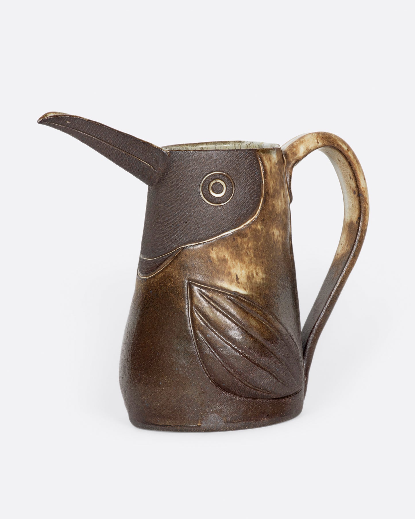 An espresso brown bird pitcher with white glaze speckles.