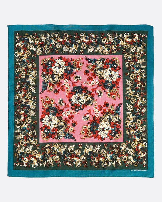 A cotton color bandana with a multicolor floral champetre design that looks like picked dianthus flowers, tied together.