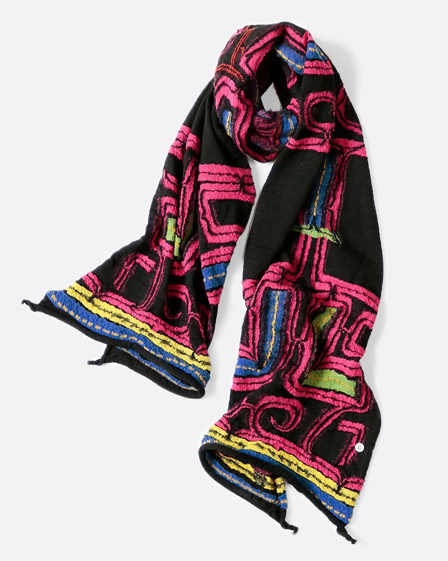 A black scarf with a neon pink Ainu pattern, shown coiled.