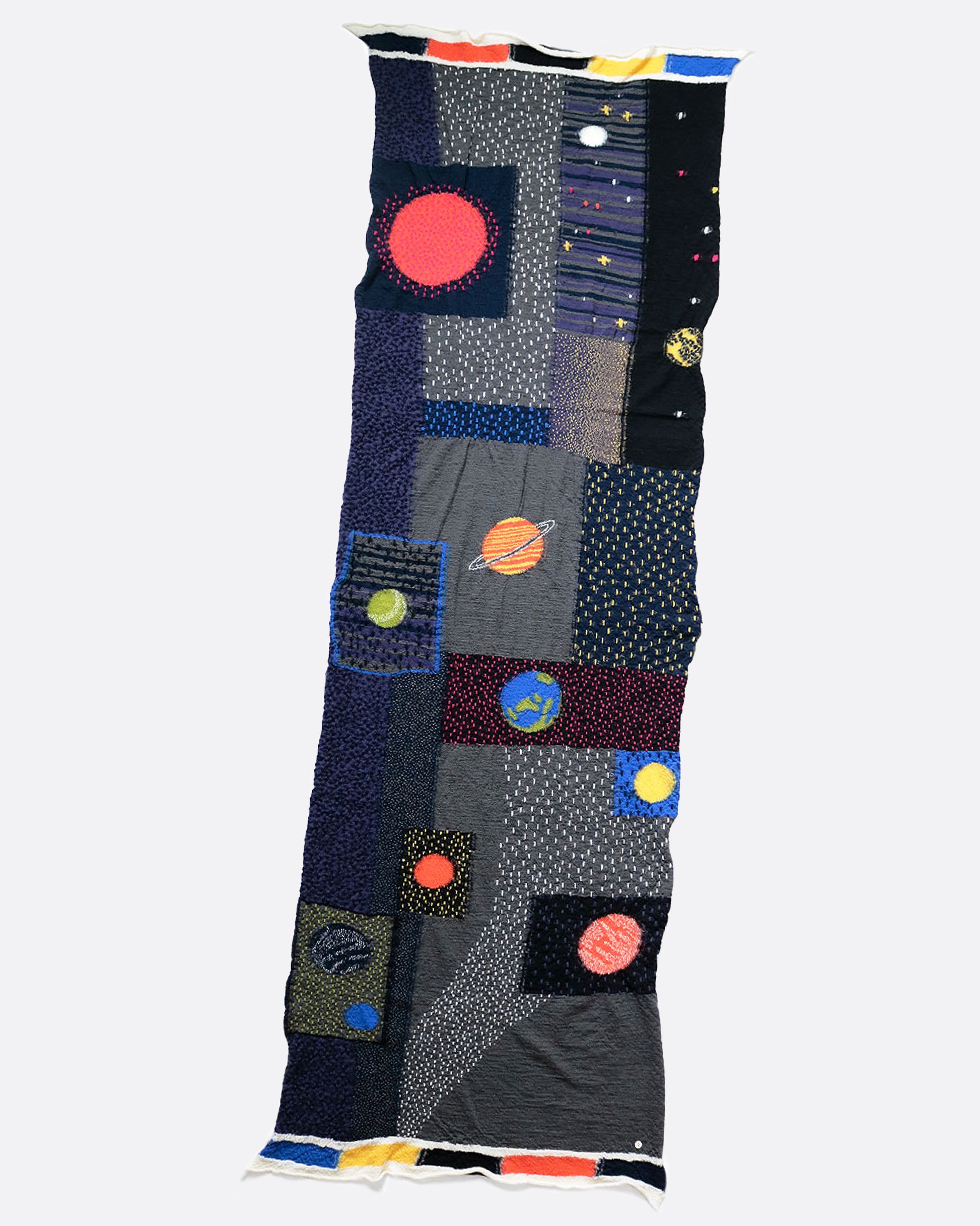 A Gabbeh style wool scarf with warm, sunlit planets.