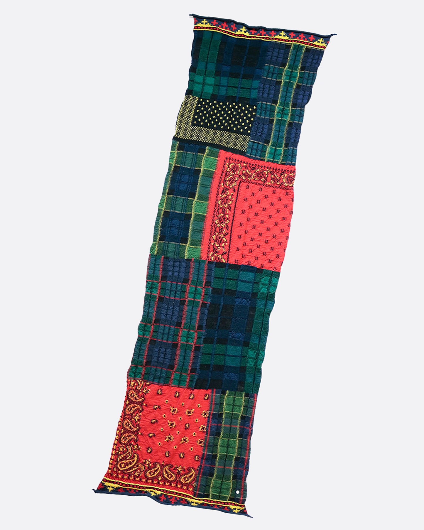A fluffy wool patchwork scarf that combines different tartan checks and bandana patterns.