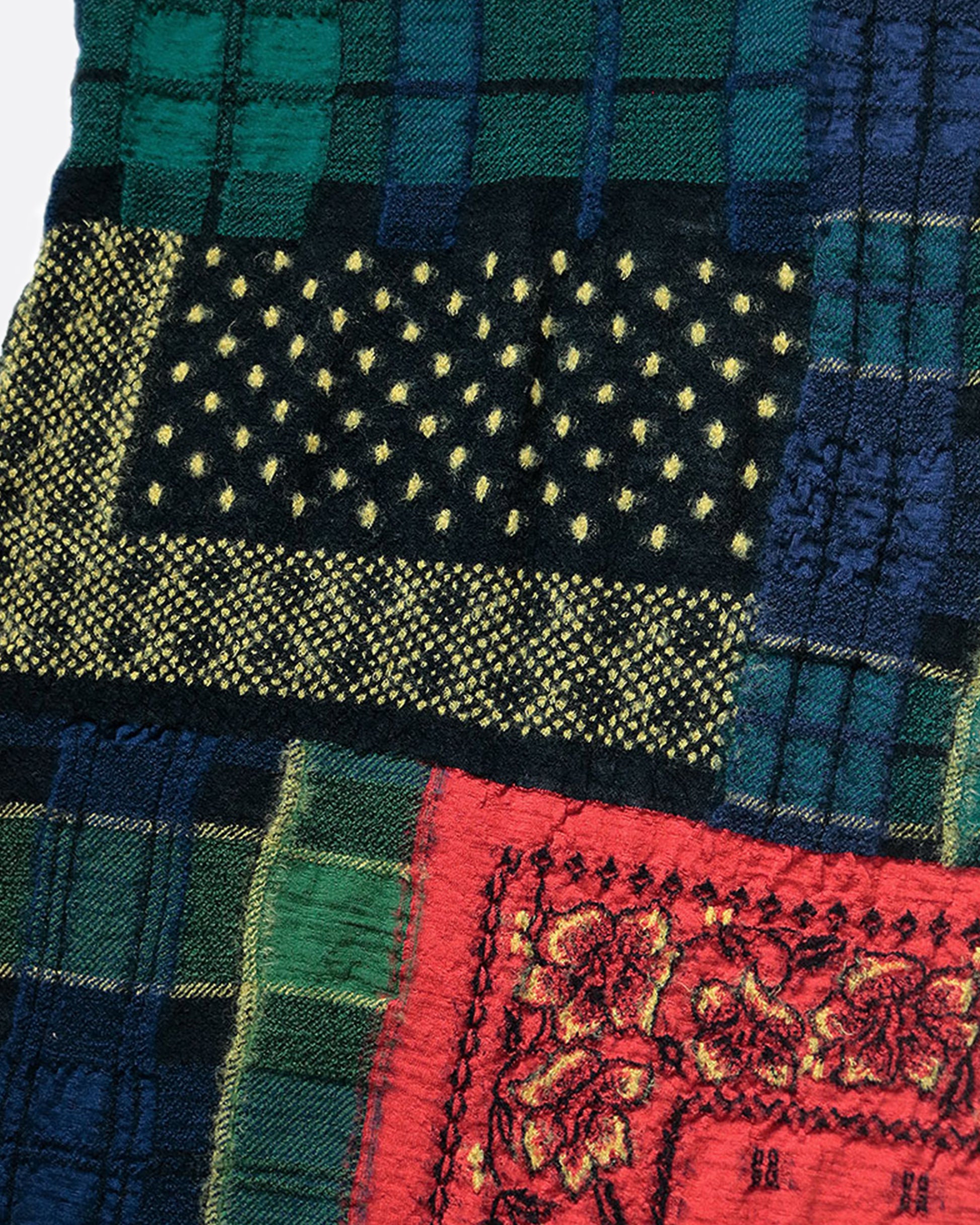 A fluffy wool patchwork scarf that combines different tartan checks and bandana patterns.