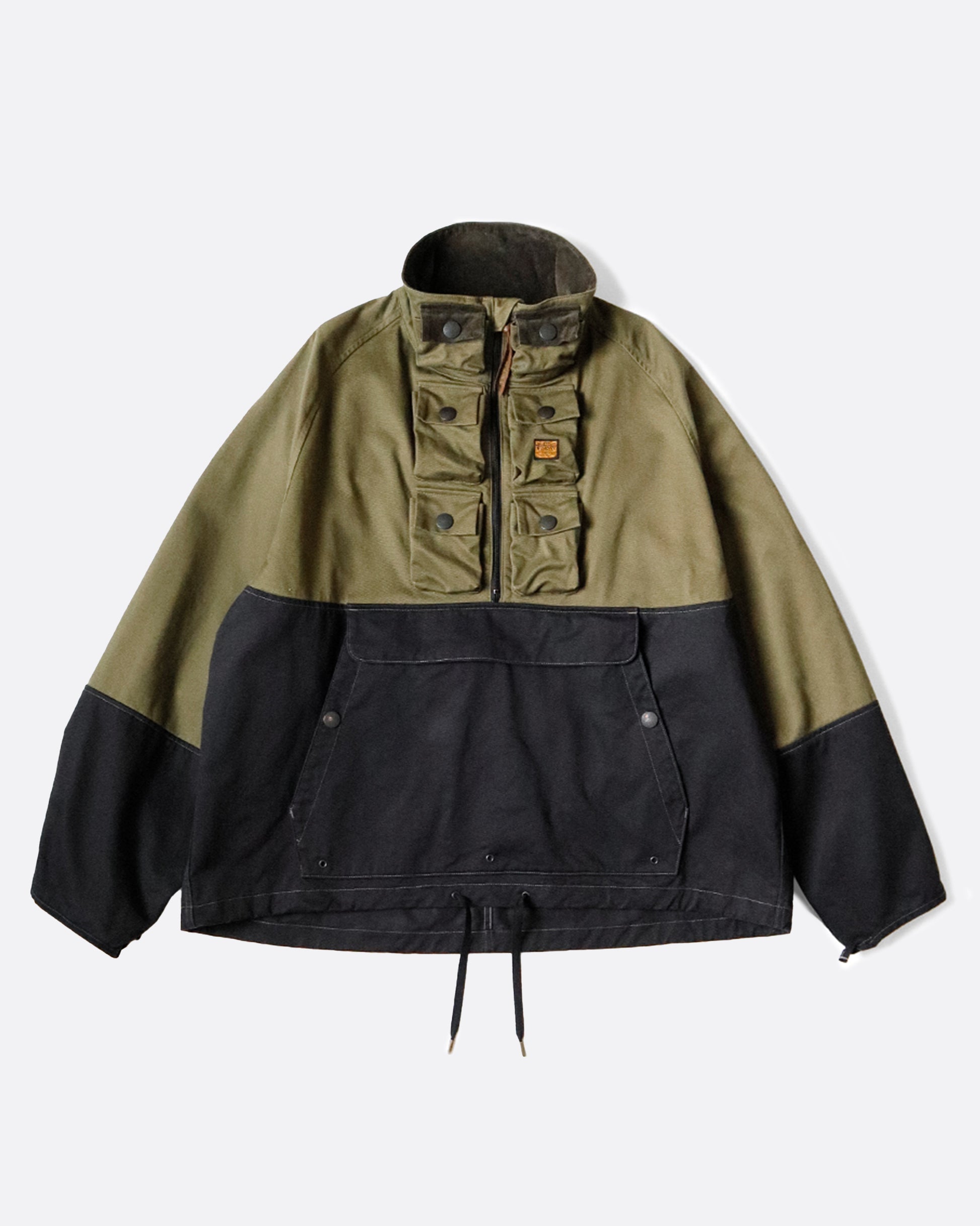 One of Kapital's beloved anoraks, made from two colors of cotton chino material with six mini pockets around the neck and a zip pocket with a flap on the front.