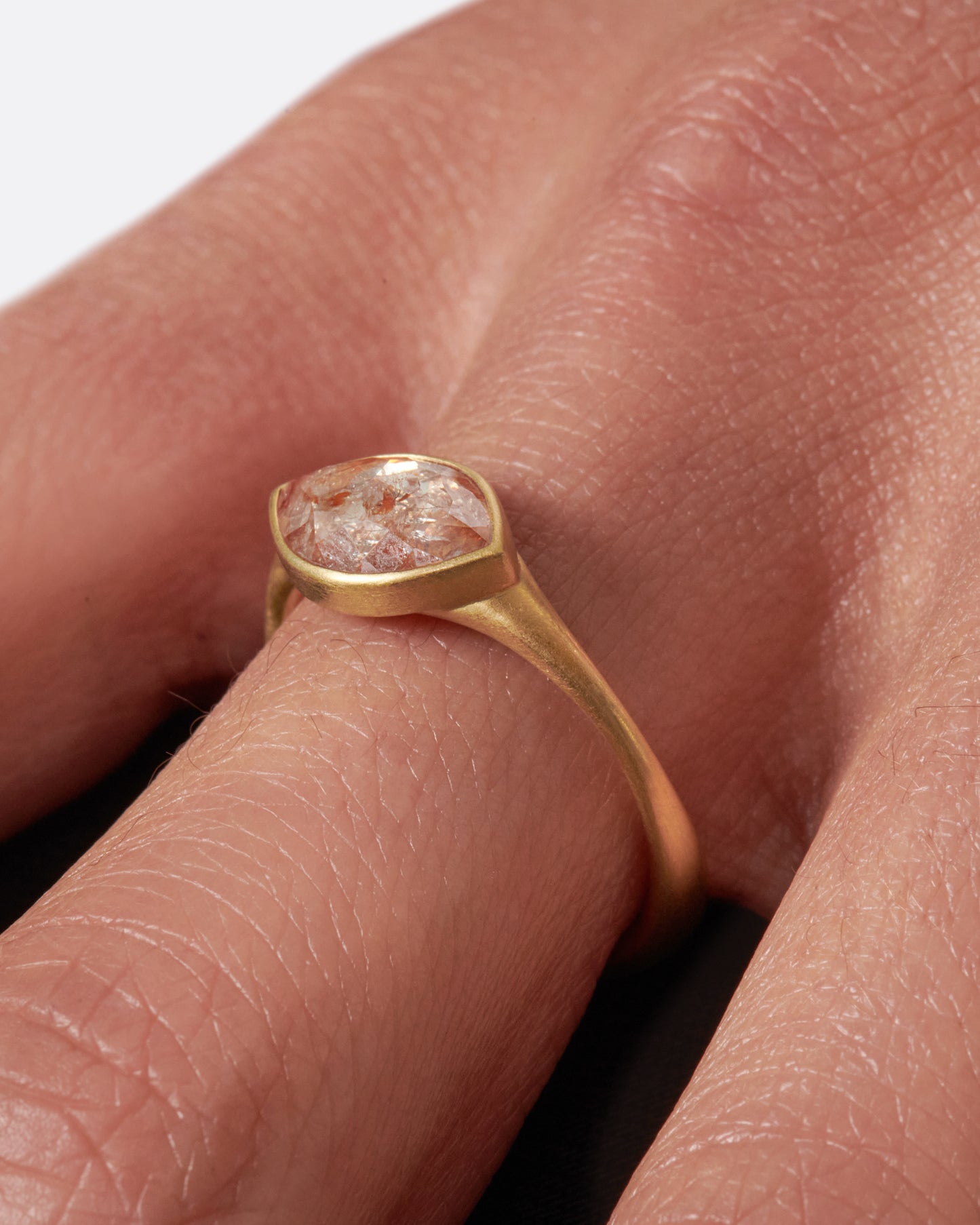 An east-west, navette shaped diamond set in one of Lola Brooks' signature bezel settings