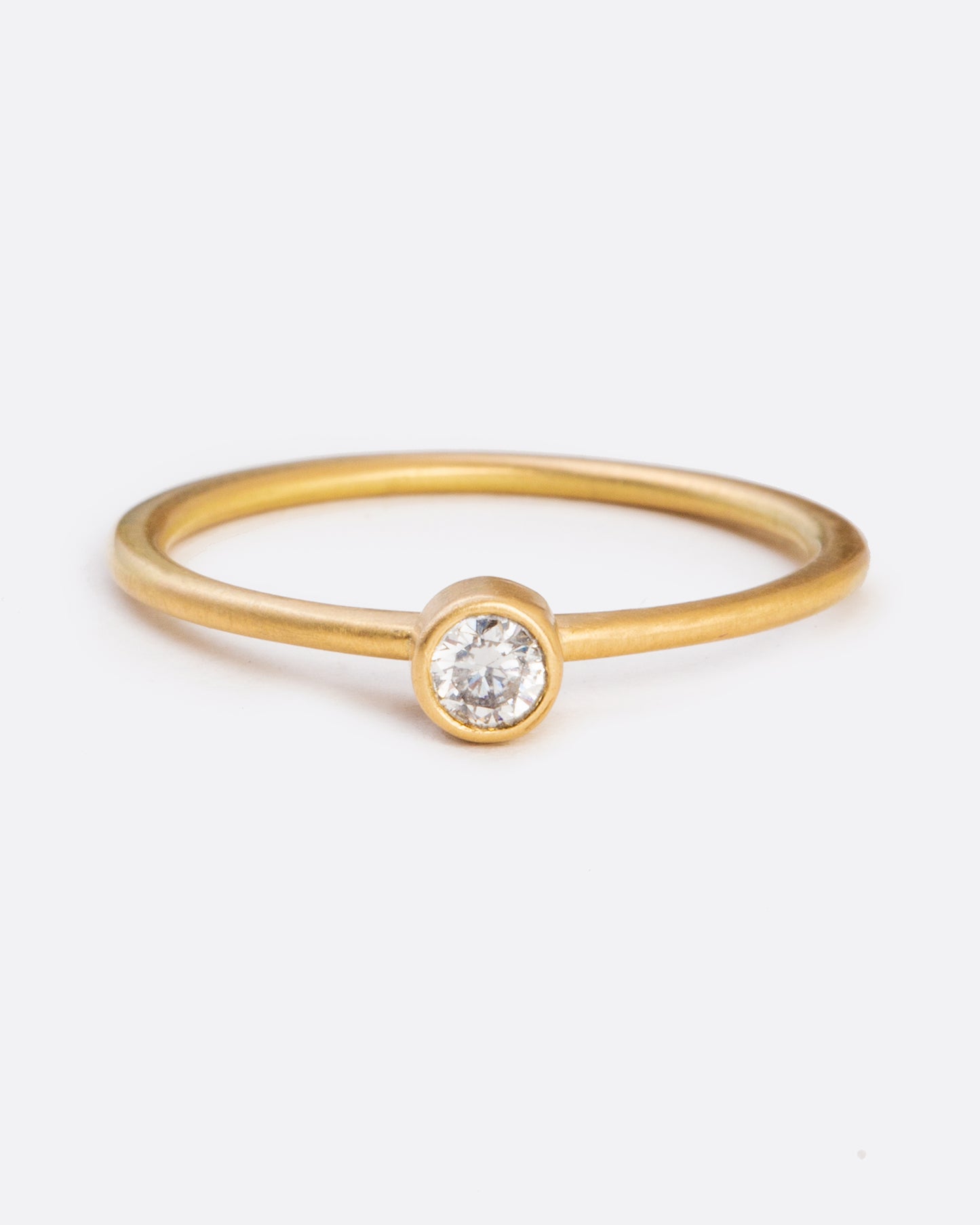 A simple ring, featuring a bezel set brilliant cut diamond with a lot of sparkle