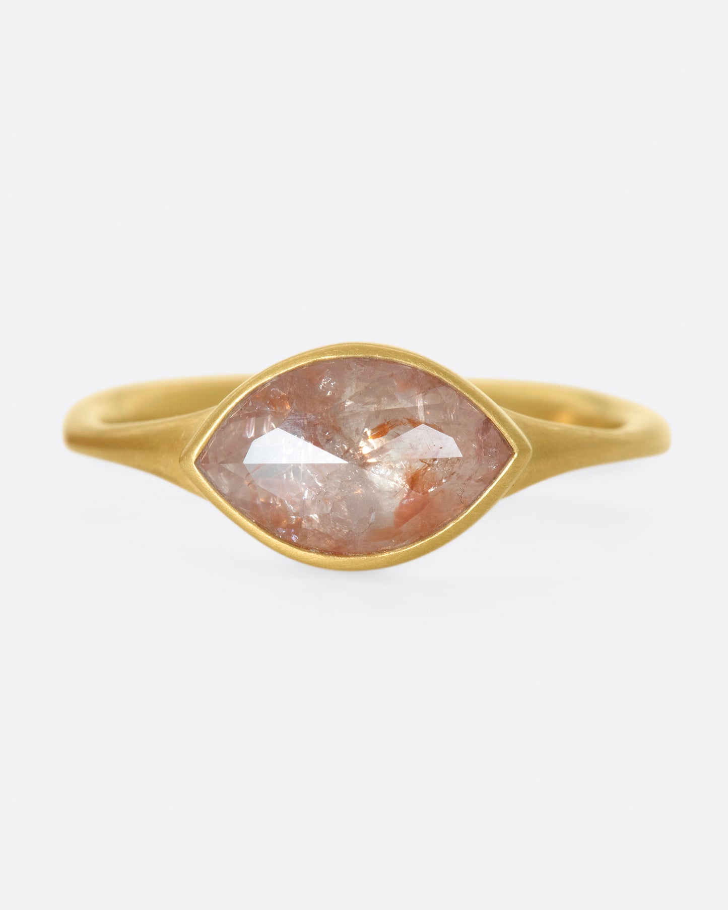 An east-west, navette shaped diamond set in one of Lola Brooks' signature bezel settings