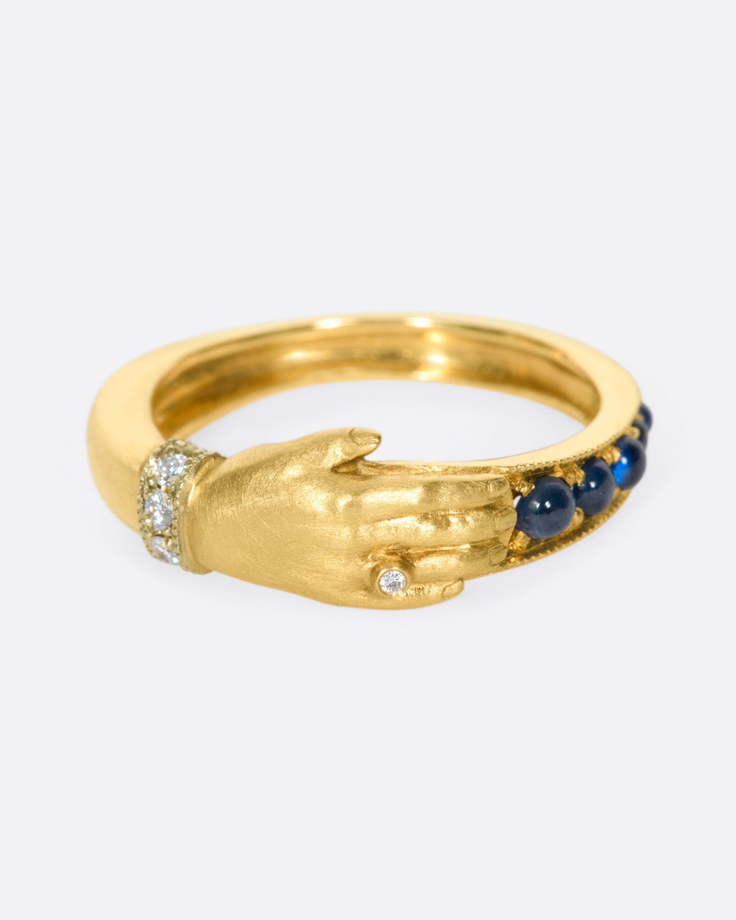 The design of this ring is driven by a combination of Anthony Lent's fascinations with ancient jewelry and the world of the miniature.