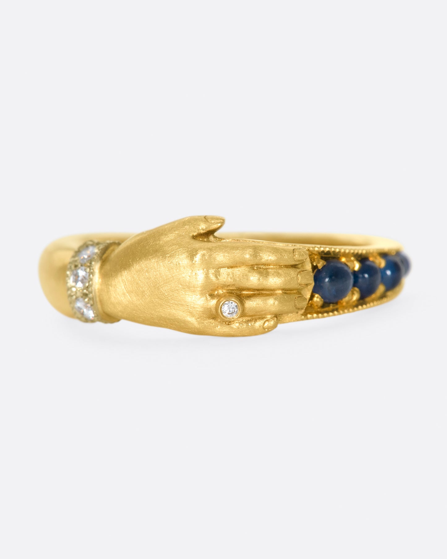 The design of this ring is driven by a combination of Anthony Lent's fascinations with ancient jewelry and the world of the miniature.