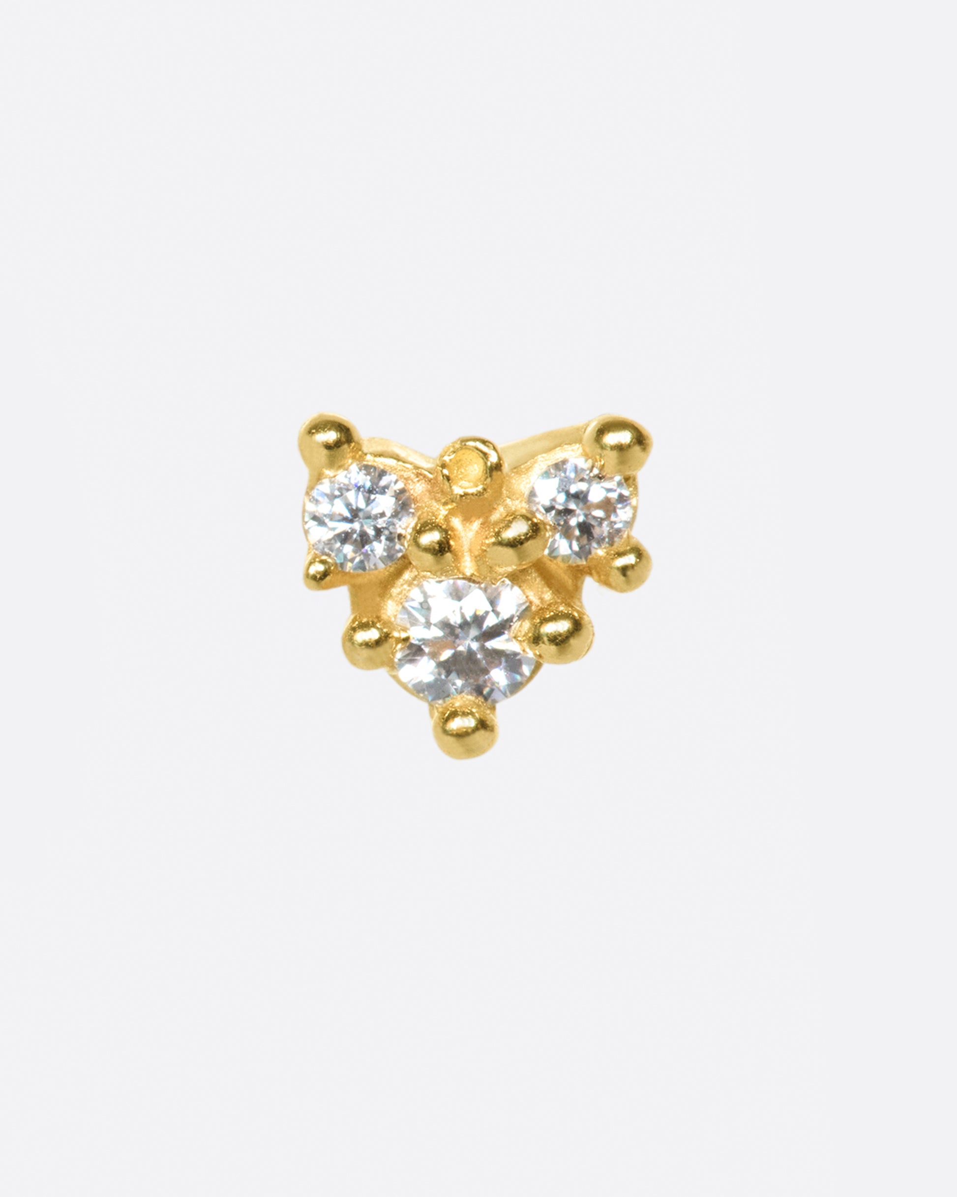 Not your average diamond earring; this piece looks great in a second or third piercing.