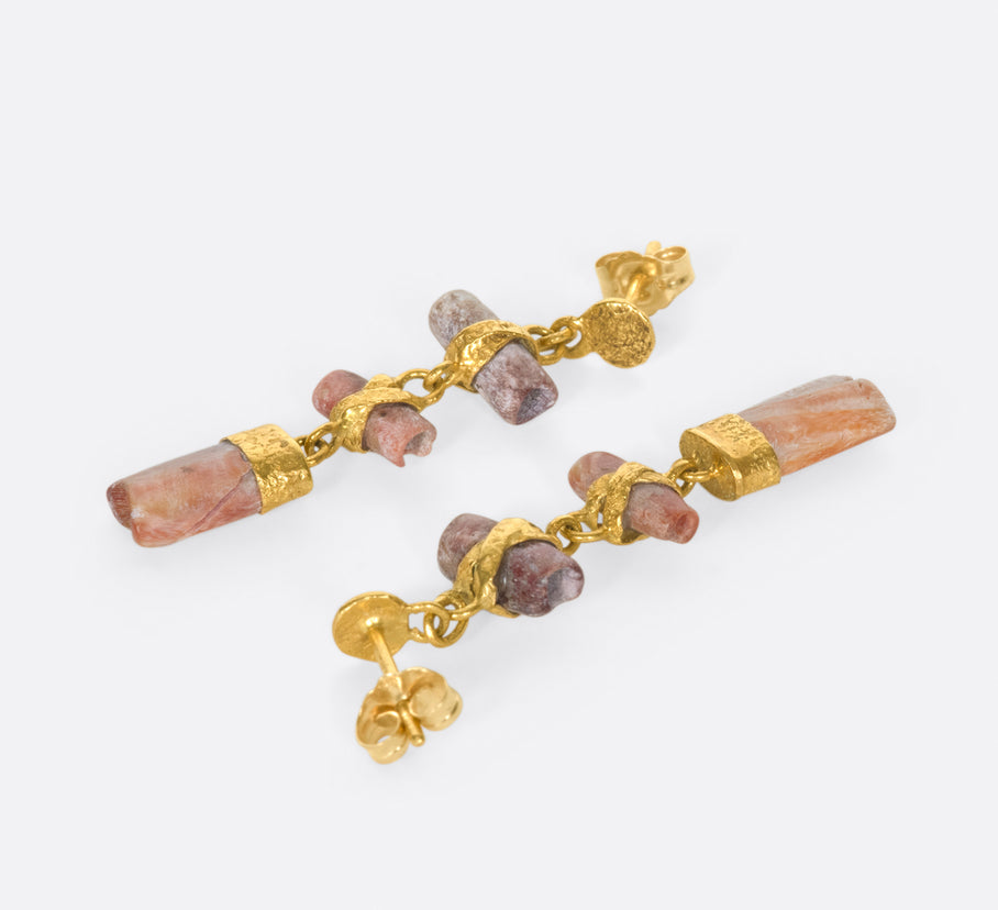 The high karat gold and peachy pink tones of these Pre-Colombian beads are a perfect match.
